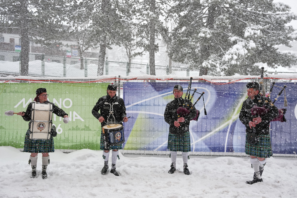 Italian bagpipers practice outside the curling stadium at the 2026 Winter Olympics, in Cortina d'Ampezzo, Italy, Thursday, Feb. 19, 2026. (AP Photo/Misper Apawu)