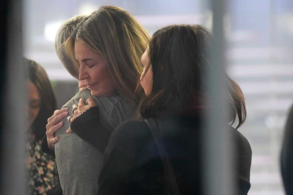 Savannah Guthrie hugs a staff member during a visit to the Today show at Rockefeller Plaza in New York on Thursday, March 5, 2026. (Photo by Charles Sykes/Invision/AP)