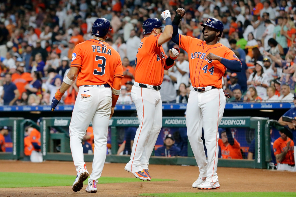 Houston Astros Jeremy Peña (3), designated hitter Isaac Paredes (15) and Yordan Alvarez (44) celebrate after they all score on the three run home run by Paredes against the Athletics during the first inning of a baseball game Friday, June 5, 2026, in Houston. (AP Photo/Michael Wyke)