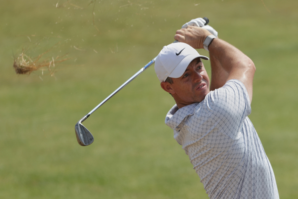 Rory McIlroy of Northern Ireland play a shot from the light round on the 7th during the second day of the British Open Golf championships at Royal Birkdale golf club, in Southport, England, Friday, July 17, 2026. (AP Photo/Peter Morrison)