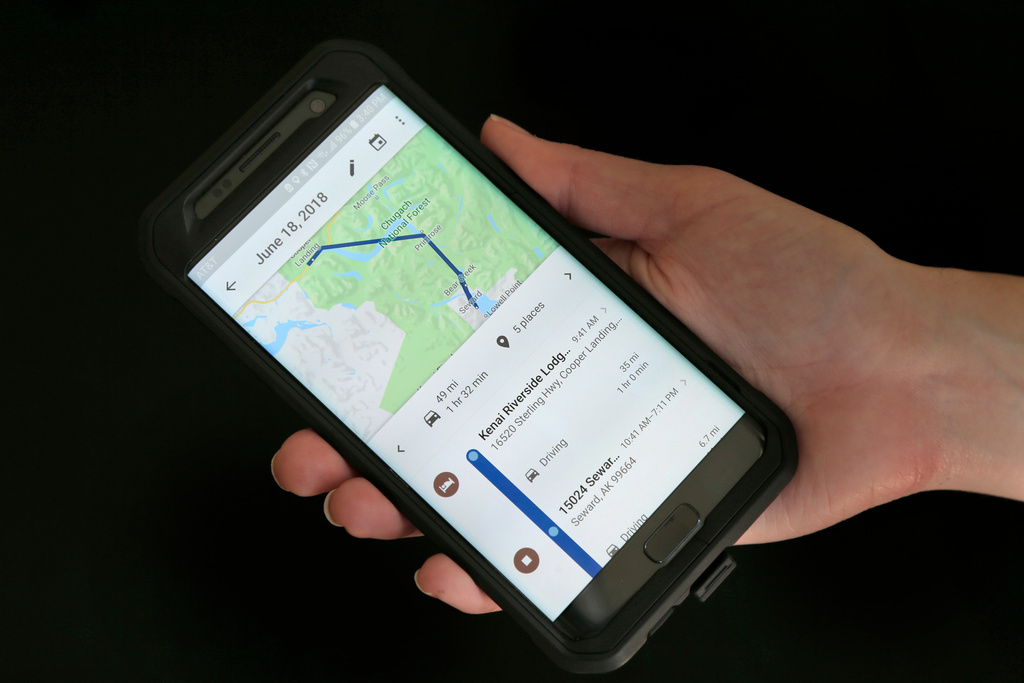 FILE - In this Aug. 8, 2018, file photo, a mobile phone displays a user's travels using Google Maps in New York. (AP Photo/Seth Wenig, File)