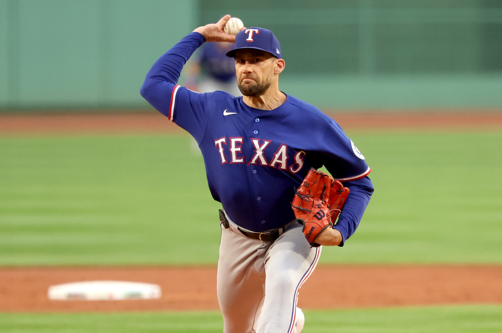 Texas Rangers pitcher Nathan Eovaldi throws during the first inning of a baseball game against the Boston Red Sox, Sunday, June 14, 2026, in Boston. (AP Photo/Mark Stockwell)