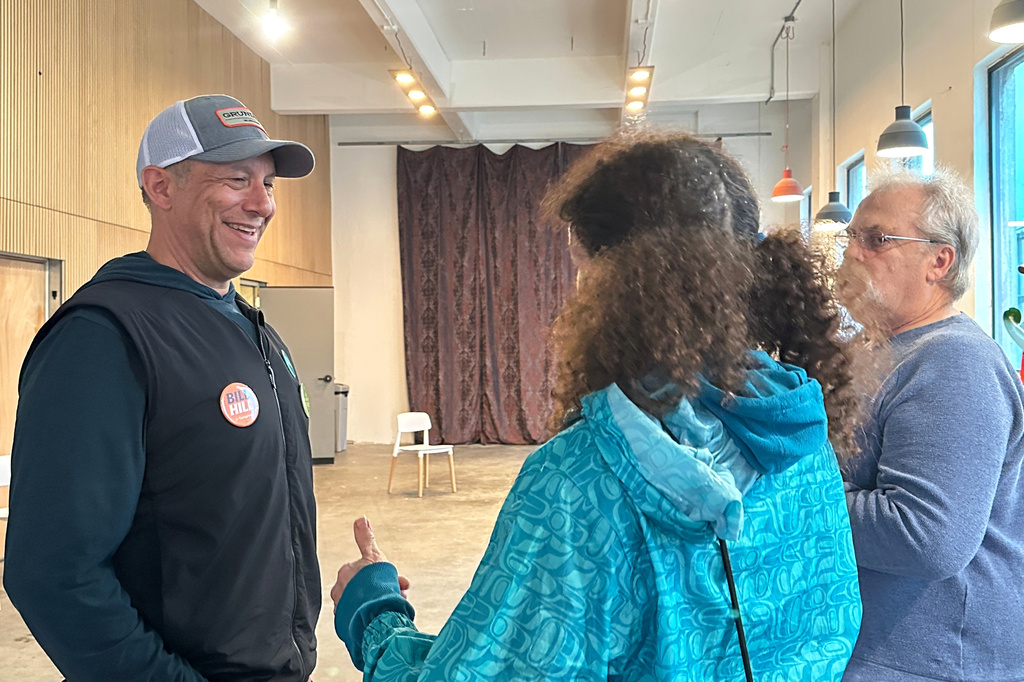 FILE - Alaska U.S. House candidate Bill Hill, an independent, speaks with people at a campaign fundraising event in Juneau, Alaska, June 4, 2026. (AP Photo/Becky Bohrer, File)