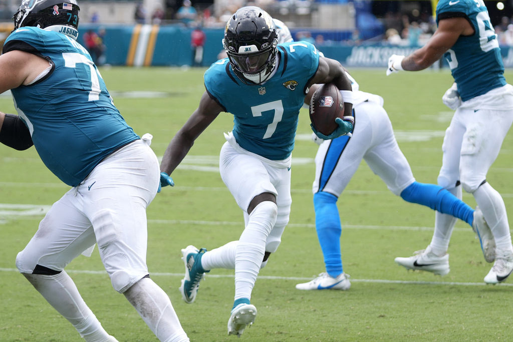 Jacksonville Jaguars wide receiver Brian Thomas Jr. (7) runs to score a touchdown against the Carolina Panthers during the first half of an NFL football game, Sunday, Sept. 7, 2025, in Jacksonville, Fla. (AP Photo/John Raoux)
