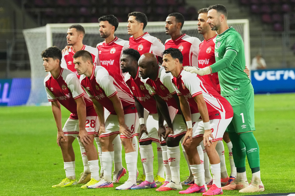 Hapoel Beer-Sheva's players pose for the team picture before the Europa League opening phase soccer match between Hapoel Beer-Sheva and Dinamo Zagreb in Bucharest, Romania, Wednesday, Sept. 16, 2026. (AP Photo/Andreea Alexandru)