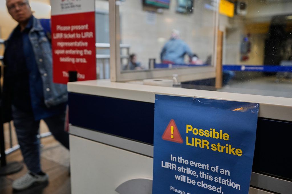 A sign warns commuters of a potential Long Island Rail Road strike at Penn Station in New York, Thursday, May 14, 2026. (AP Photo/Seth Wenig)