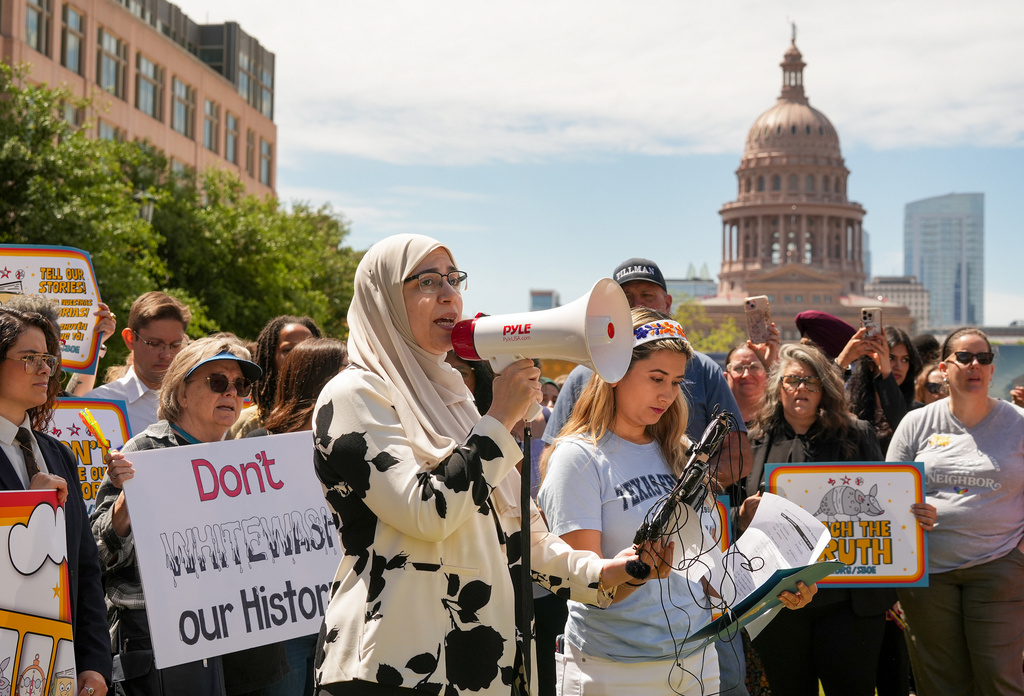 Shaimaa Zayan, with the Council on American-Islamic Relations, speaks during a rally on the Capitol Mall outside the Barbara Jordan State Office Building, where the State Board of Education meets, Tuesday, April 7, 2026, in Austin, Texas. (Jay Janner/Austin American-Statesman via AP)