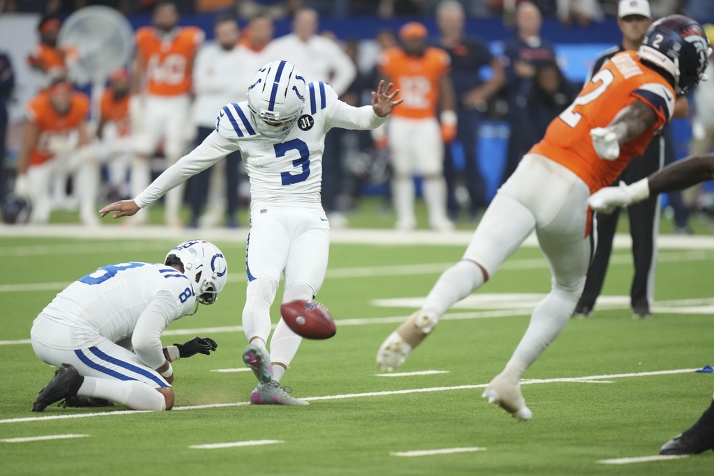 Indianapolis Colts place kicker Spencer Shrader (3) kicks the game winning field goal out of the hold of Rigoberto Sanchez during the second half an NFL football game against the Denver Broncos, Sunday, Sept. 14, 2025, in Indianapolis. (AP Photo/AJ Mast)