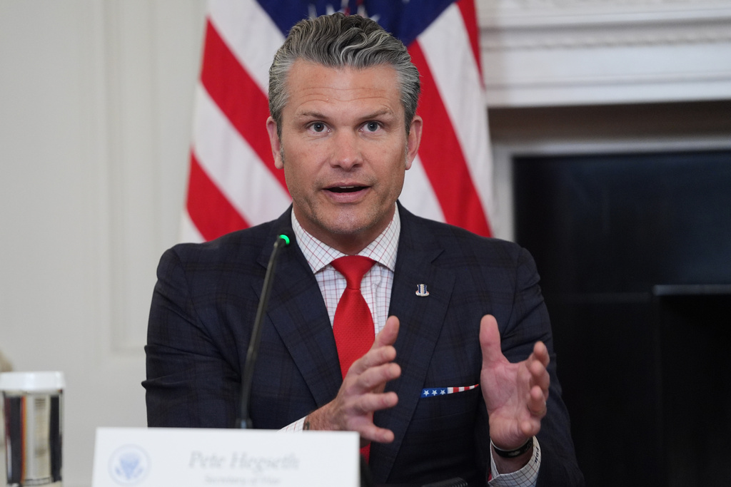 Defense Secretary Pete Hegseth answers a question from a reporter during a roundtable on criminal cartels in the State Dining Room of the White House, Thursday, Oct. 23, 2025, in Washington. (AP Photo/Evan Vucci)