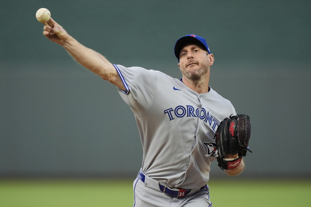 Toronto Blue Jays starting pitcher Max Scherzer throws during the first inning of a baseball game against the Kansas City Royals, Friday, Sept. 19, 2025, in Kansas City, Mo. (AP Photo/Charlie Riedel)