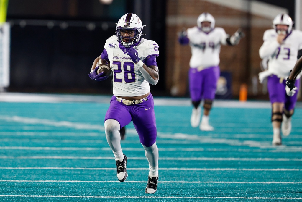 James Madison running back Jobi Malary (28) breaks away for a touchdown run against Coastal Carolina during the second half of an NCAA college football game in Conway, S.C., Saturday, Nov. 29, 2025. (AP Photo/Nell Redmond)