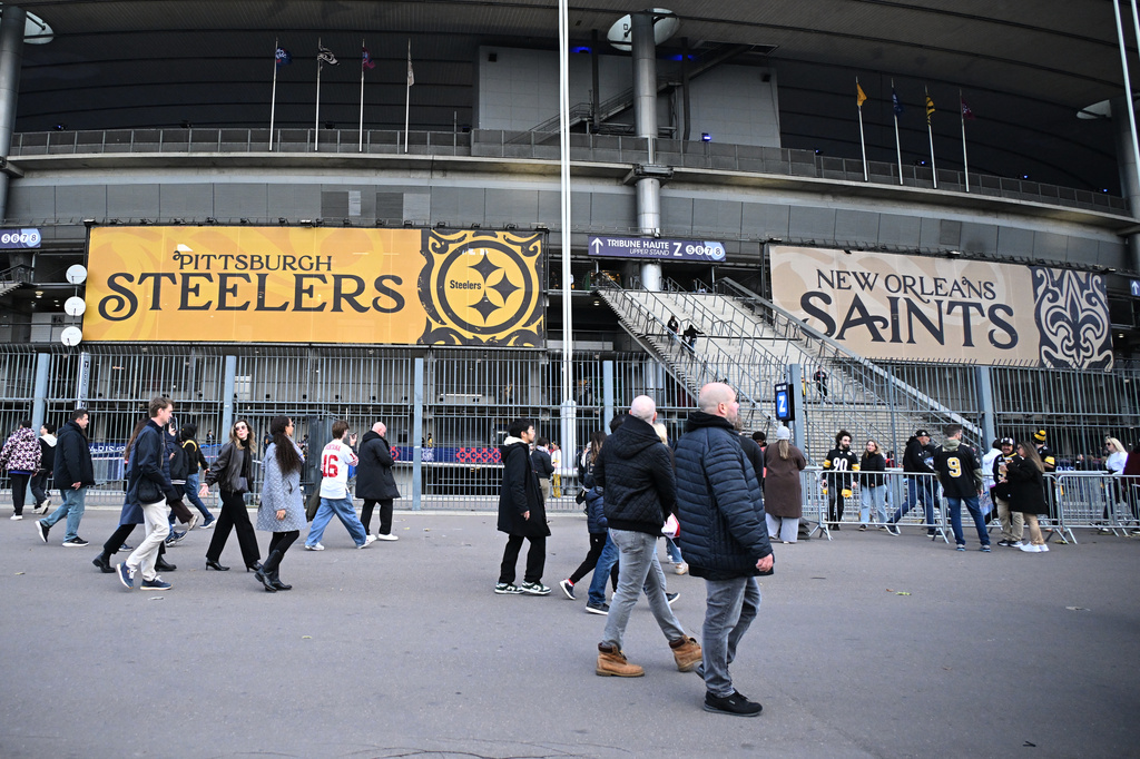Supporters walk outside the Stade de France stadium before the start of the NFL football game between Pittsburgh Steelers and New Orleans Saints in Saint-Denis, outside Paris, Sunday, Oct. 25, 2026. (AP Photo/Emma Da Silva)