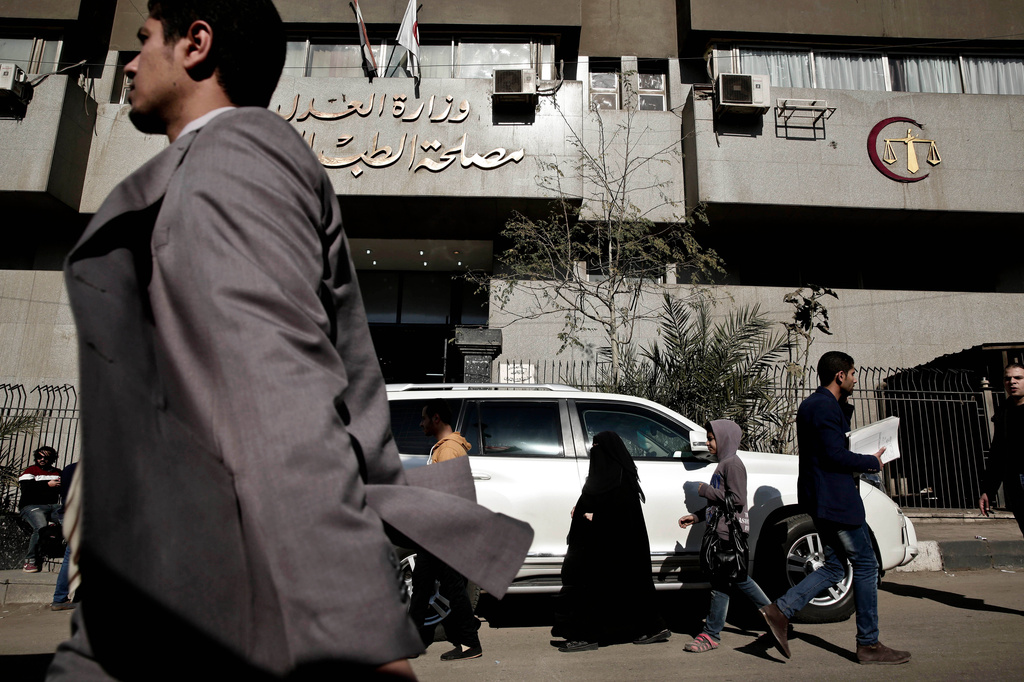 FILE - A vehicle belonging to the Italian ambassador is parked outside Zeinhom morgue, where the body of Giulio Regeni is being held, Feb. 4, 2016. (AP Photo/Nariman El-Mofty, File)