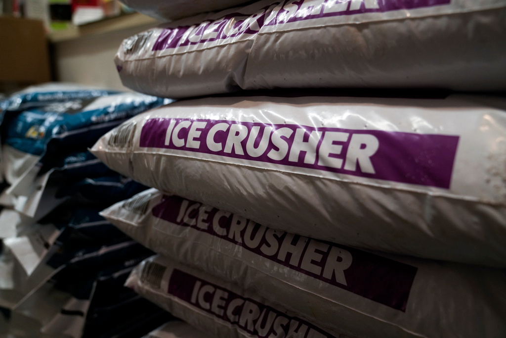 FILE - Ice Crusher, a calcium chloride blend road salt, is displayed for sale at Ankeny Hardware, Jan. 11, 2024, in Portland, Ore. (AP Photo/Jenny Kane, File)