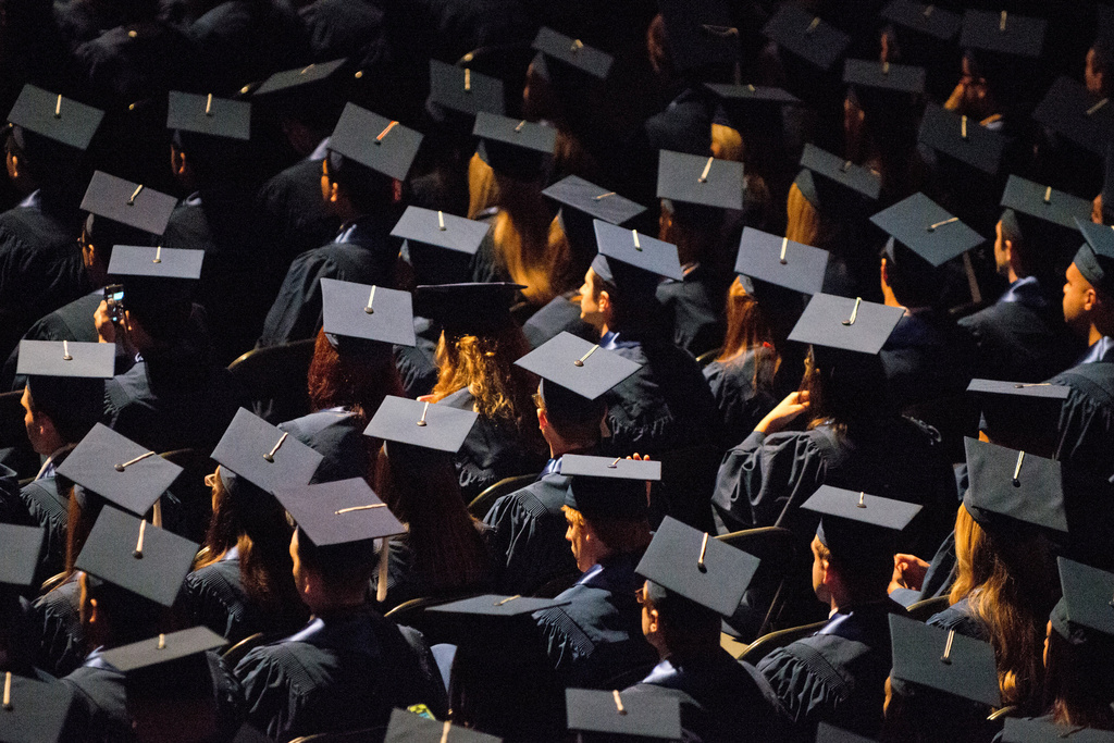 FILE - Students attend commencement ceremonies in the State Farm Center at the University of Illinois in Champaign, Ill., on Sunday, May 12, 2013. (Darrell Hoemann/The News-Gazette via AP, File)