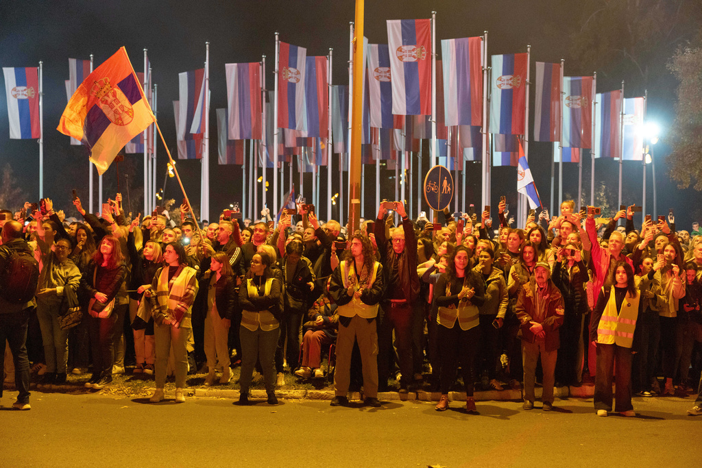 People cheer as a group of students arrive before a rally on Nov. 1, marking the first anniversary of a train station disaster that killed 16 people, in Novi Sad, Serbia, Friday, Oct. 31, 2025. (AP Photo/Marko Drobnjakovic)