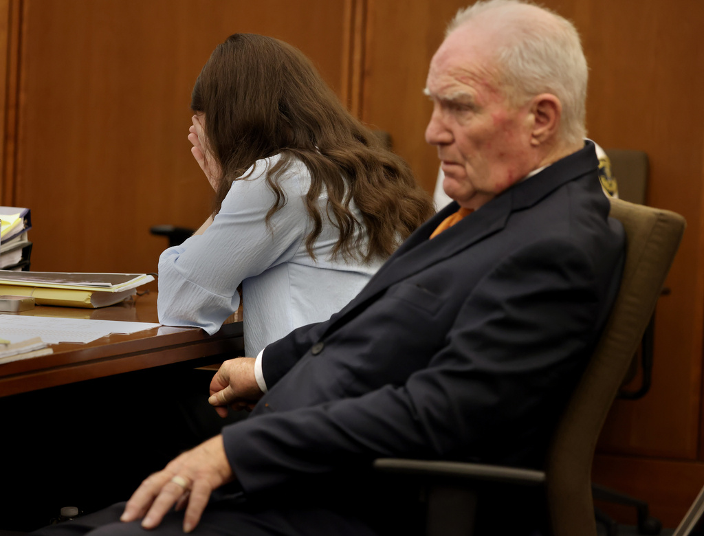 Defense attorney Kevin Reddington and Lindsay Clancy listen to the 911 recording from Jan. 24, 2023, during Clancy's murder trial at Plymouth Superior Court in Plymouth, Mass., on Wednesday, July 29, 2026. (David L. Ryan/The Boston Globe via AP, Pool)