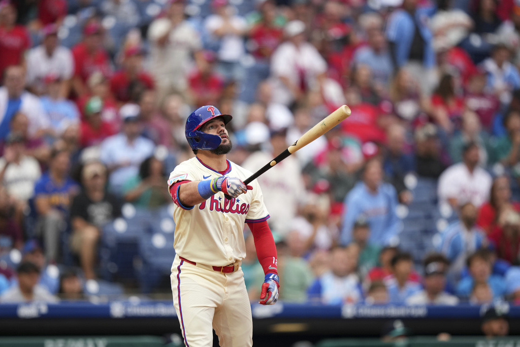 Philadelphia Phillies' Kyle Schwarber watches after hitting a two-run home run against Seattle Mariners pitcher Sauryn Lao during the eighth inning of a baseball game Wednesday, Aug. 20, 2025, in Philadelphia. (AP Photo/Matt Slocum)