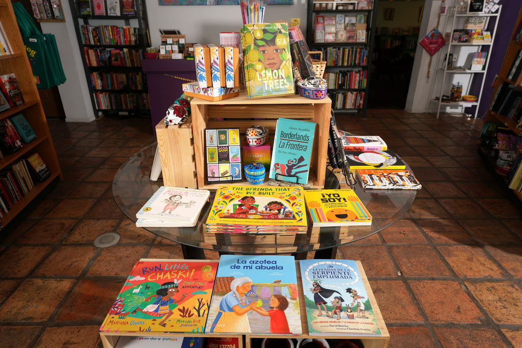 Book are on display at Palabras Bilingual Bookstore Monday, Oct. 6, 2025, in Phoenix. (AP Photo/Ross D. Franklin)