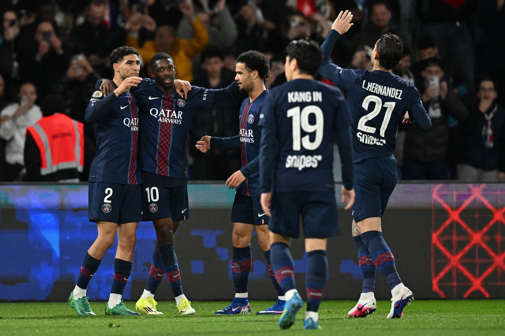 PSG players celebrate after a goal during a League One soccer match between Paris Saint-Germain and Toulouse in Paris, France, Friday, April 3, 2026. (AP Photo/Emma Da Silva)