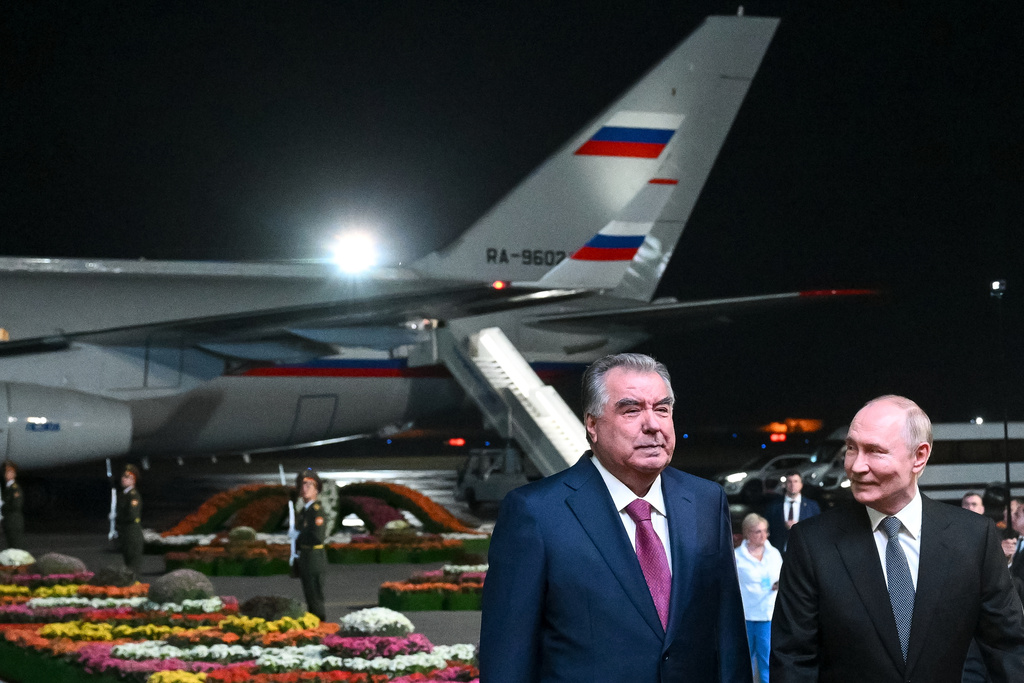 Russian President Vladimir Putin, right, is greeted by Tajik President Emomali Rahmon upon his arrival in Dushanbe, Tajikistan, Wednesday, Oct. 8, 2025. (Kristina Kormilitsyna, Sputnik, Kremlin Pool Photo via AP)