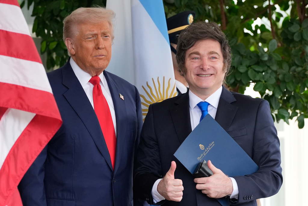 President Donald Trump greets Argentina's President Javier Milei at the White House, Tuesday, Oct. 14, 2025, in Washington. (AP Photo/Alex Brandon)