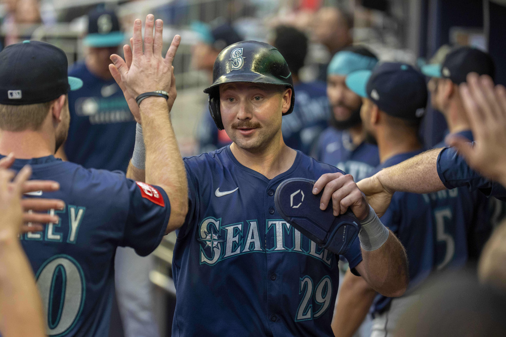 Seattle Mariners catcher Cal Raleigh (29) celebrates after scoring the first run during the first inning of a baseball game against the Atlanta Braves Saturday, Sept. 6, 2025, in Atlanta. (AP Photo/Erik Rank)