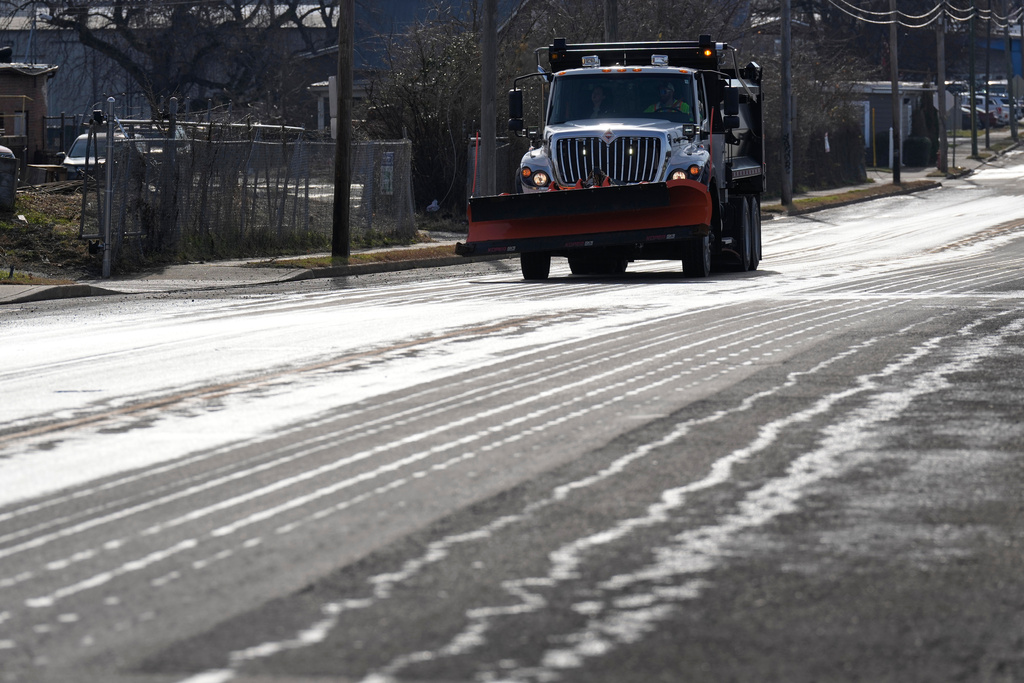 A Nashville Department of Transportation truck applies salt brine to a roadway Thursday, Jan. 22, 2026, in Nashville, Tenn. ahead of a winter storm expected to hit the state over the weekend. (AP Photo/George Walker IV)