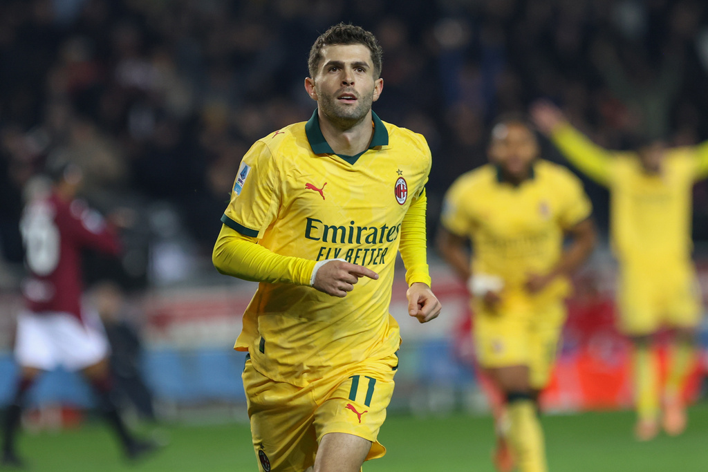 Milan's Christian Pulisic celebrates after scoring a goal during the Serie A soccer match between Torino FC and Milan in Turin, Italy, Monday, Dec. 8, 2025. (Tano Pecoraro/LaPresse via AP)