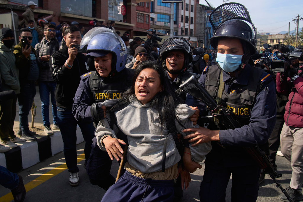 Nepalese police detain a young protester during an anti-government rally in Kathmandu, Nepal, on Dec. 22, 2025. (AP Photo/Niranjan Shrestha)
