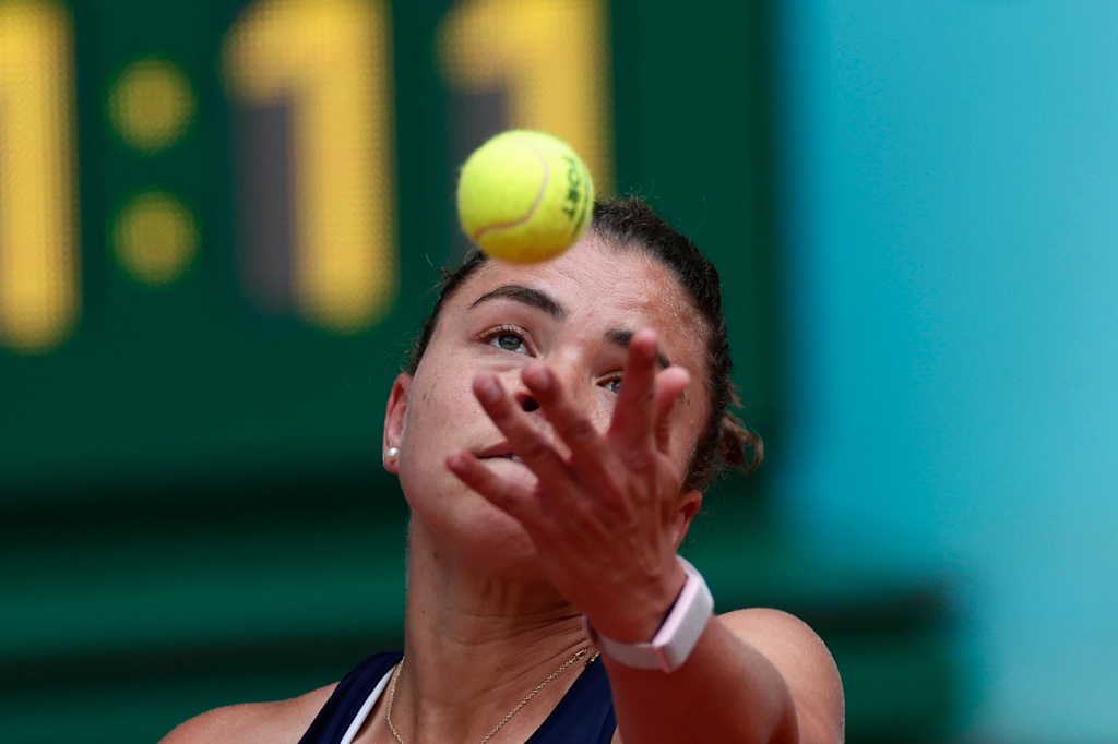 Jasmine Paolini of Italy serves to Hailey Baptiste of the U.S. during the Madrid Open tennis tournament in Madrid, Saturday, April 25, 2026. (AP Photo/Pablo Garcia)