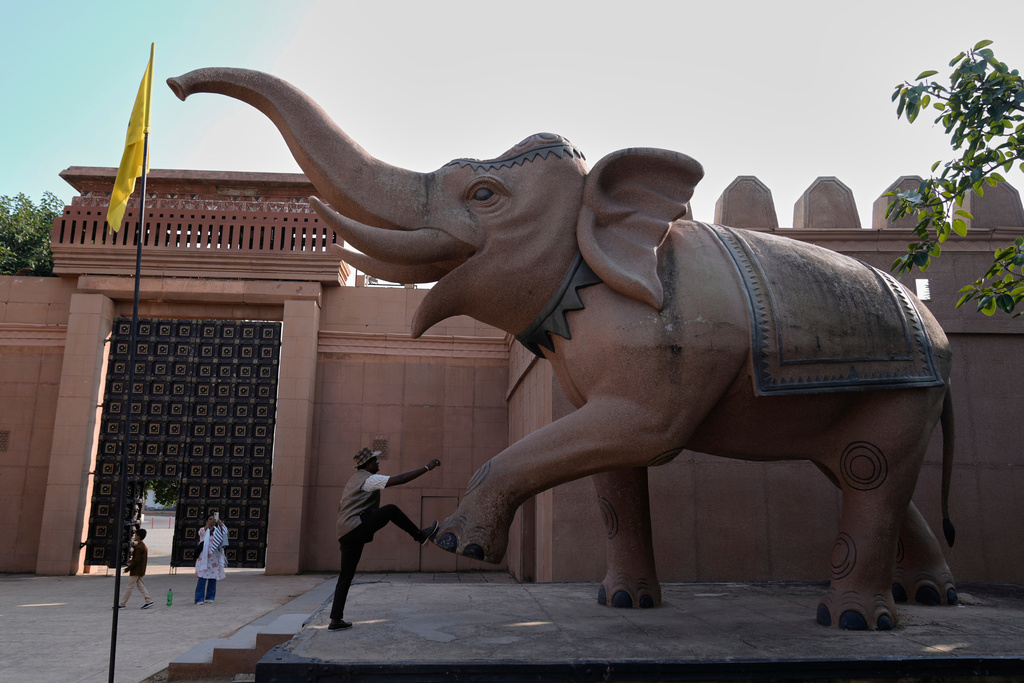 Visitors explore the sets of the film 'Bahubali' in Ramoji Film City in Hyderabad, India, Tuesday, Nov. 18, 2025. (AP Photo/Mahesh Kumar A.)