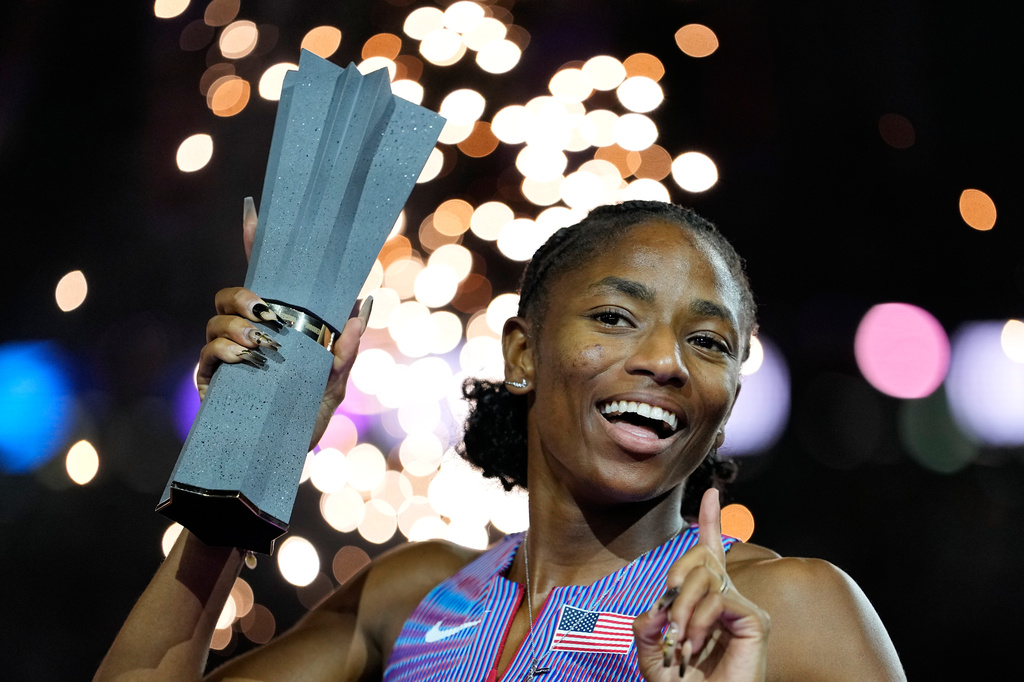 Melissa Jefferson-Wooden, of the United States, poses with her trophy after winning the women's 200 meters final at the World Athletics Ultimate Championship in Budapest, Hungary, Sunday, Sept. 13, 2026. (AP Photo/Matthias Schrader)