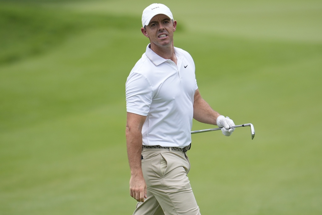 Rory McIlroy, of Northern Ireland, watches his shot on the first fairway during the first round of the Tour Championship golf tournament, Thursday, Aug. 21, 2025, in Atlanta. (AP Photo/Mike Stewart)