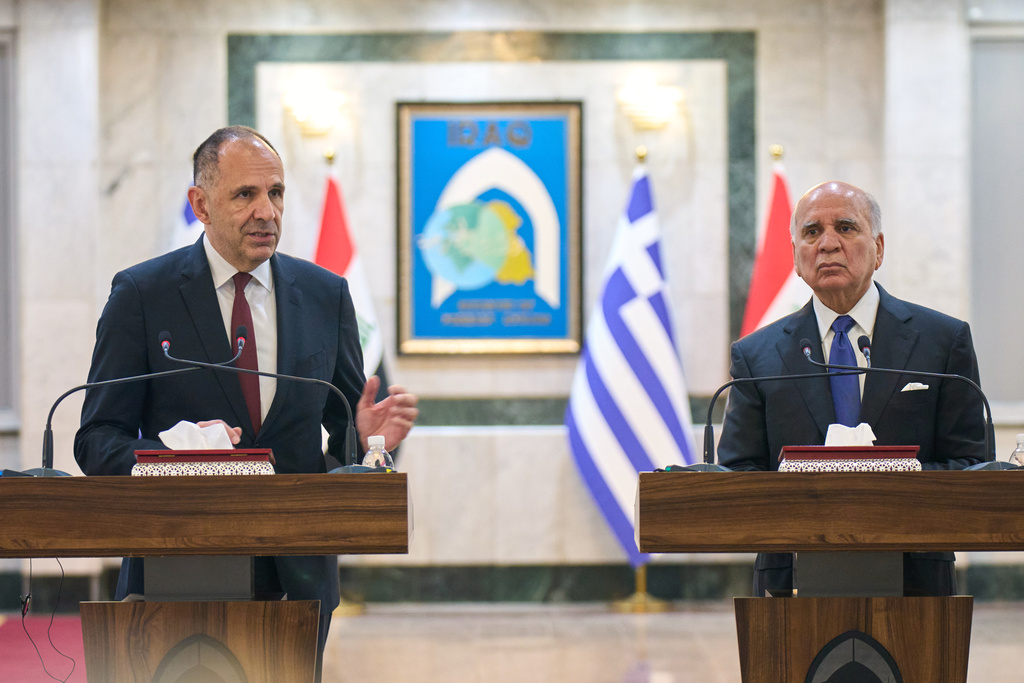 Greek Foreign Minister George Gerapetritis, left, speaks during a joint news conference with his Iraqi counterpart Fuad Hussein in Baghdad, Iraq, Thursday, Oct. 30, 2025. (AP Photo/Hadi Mizban)