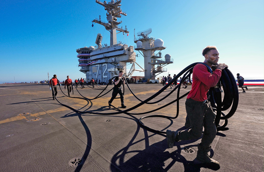 Crew members prepare the U.S.S. Abraham Lincoln (CVN 72) for return on Wednesday, Oct. 7, 2026, to her home port Naval Air Station North Island in San Diego, Calif. (Nelvin C. Cepeda/The San Diego Union-Tribune via AP)