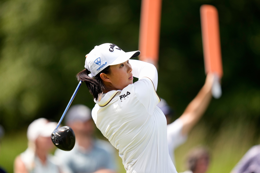 Ruoning Yin, of China, hits the 13th tee during the first round of the LPGA FM Championship golf tournament in Norton, Mass., Thursday, Aug. 27, 2026. (AP Photo/Charles Krupa)