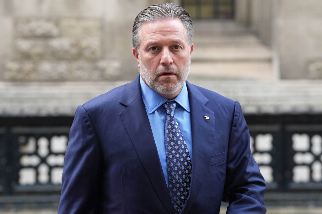 Zak Brown, CEO of McLaren Racing, arrives at the Rolls Building of the Royal Courts of Justice, in central London, to give evidence in McLaren's legal claim against Spanish racing driver Alex Palou, on Tuesday Oct. 7, 2025. (Lucy North/PA via AP)