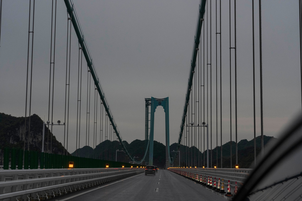 Vehicles move on the Huajiang Grand Canyon Bridge, considered to be the world’s highest bridge, in Anshun in southwestern China's Guizhou province on Friday, May 29, 2026. (AP Photo/Ng Han Guan)