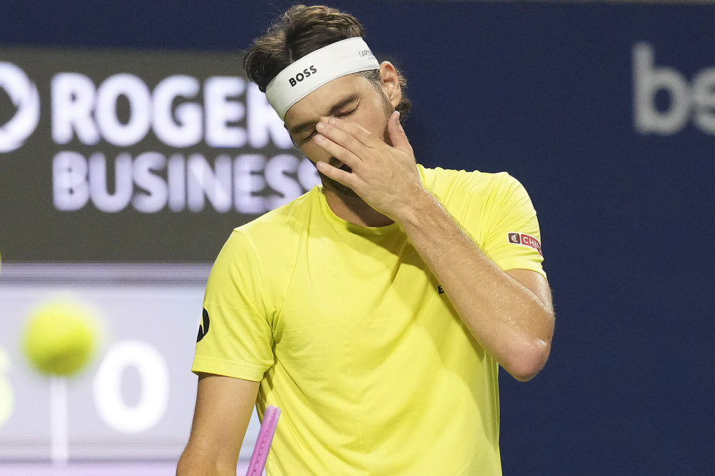 Taylor Fritz, of the United States, reacts during his loss to Ben Shelton, of the United States, after their semifinal match at the National Bank Open tennis tournament in Toronto on Wednesday, Aug. 6, 2025. (Chris Young/The Canadian Press via AP)