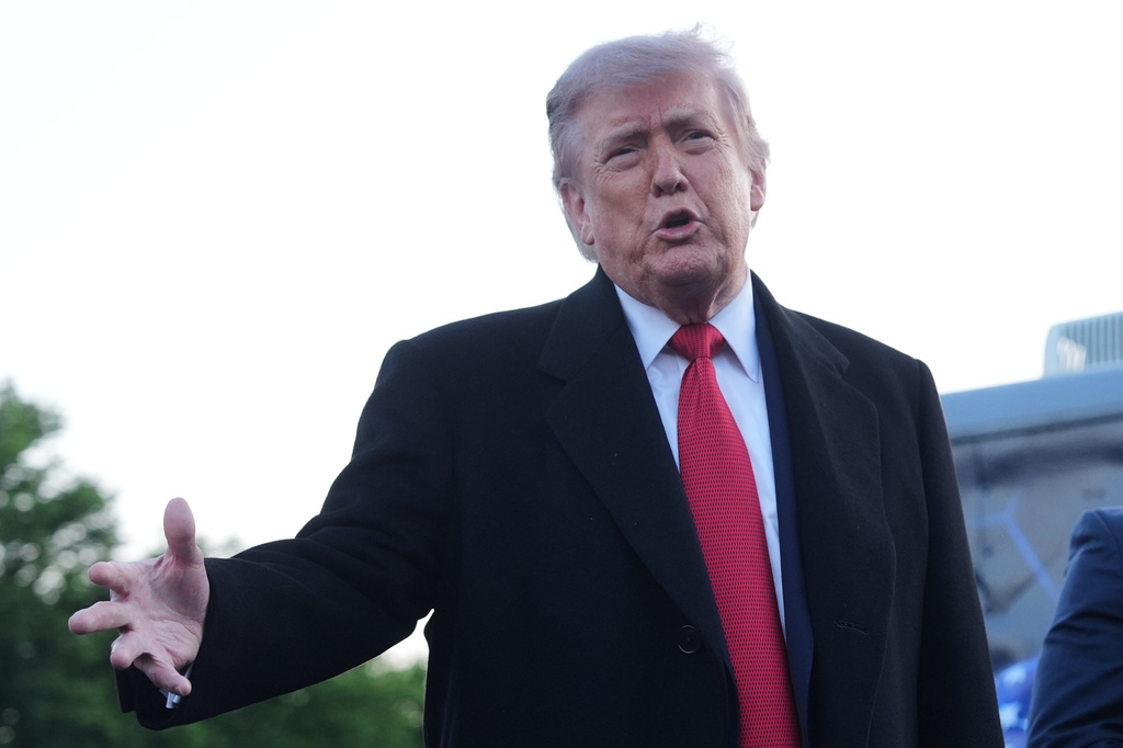 President Donald Trump speaks as he visits the Lincoln Memorial Reflecting Pool to see the new blue protective coating being applied as part of a renovation project, Thursday, May 7, 2026, in Washington. (AP Photo/Mark Schiefelbein)