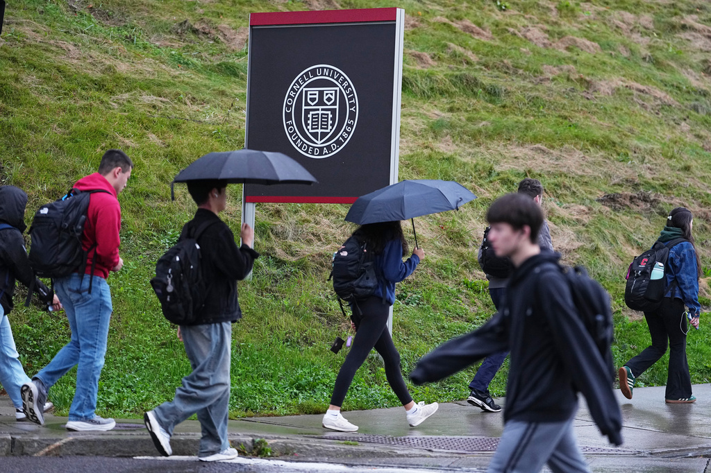 Students walk across the campus of Cornell University in Ithaca, N.Y., Thursday, Oct. 1, 2026. (AP Photo/Matt Rourke)