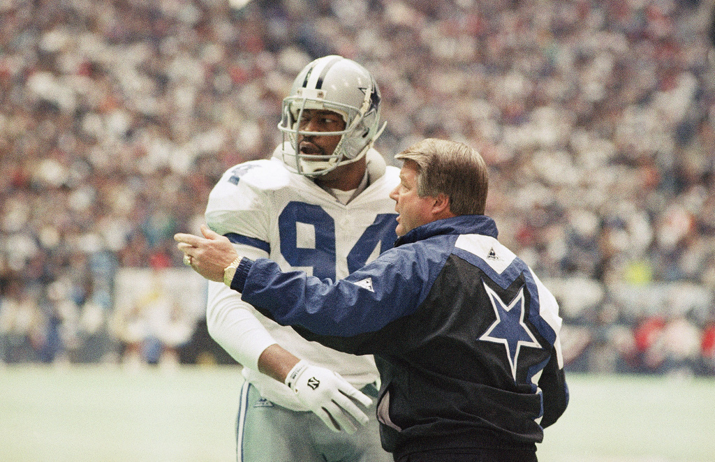 FILE - Dallas Cowboys' coach Jimmy Johnson, right confers with defensive end Charles Haley in the first half of their NFC championship game against the San Francisco 49ers, Jan. 23, 1994, in Irving, Texas. (AP Photo/Linda Kaye, File)