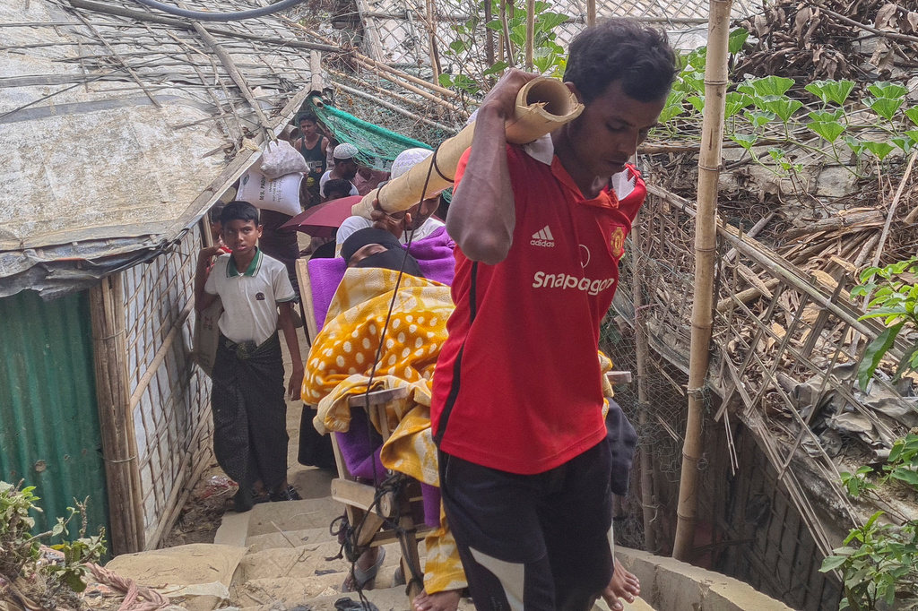 Rahela Begum, a Rohingya survivor, is carried on a bamboo stretcher to a hospital after being rescued on April 9, 2026 from a capsized boat, at a refugee camp in Cox's Bazar, Wednesday, April 15, 2026. (AP Photo/Suzauddin Rubel)