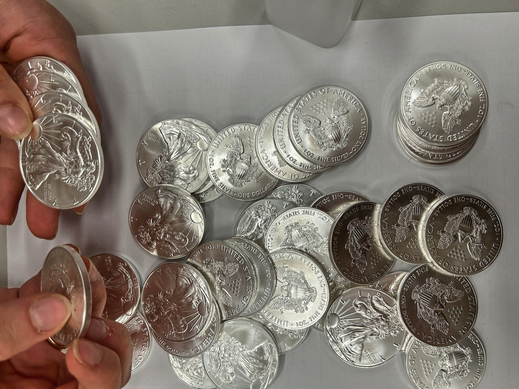 This handout photo released by Norwegian economic crime investigators on Thursday, Sept. 17, 2026, shows the U.S. "American Eagle" silver coins discovered by police in a van that was stopped after being driven "erratically" outside Oslo in April 2025. (Norwegian economic crime investigators via AP)