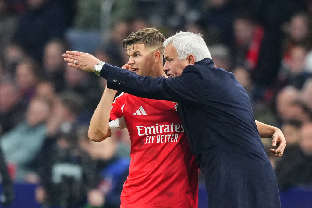 Benfica's head coach Jose Mourinho gives instructions to Benfica's Samuel Dahl during the Champions League opening phase soccer match between Ajax and SL Benfica in Amsterdam, Netherlands, Tuesday, Nov. 25, 2025. (AP Photo/Peter Dejong)