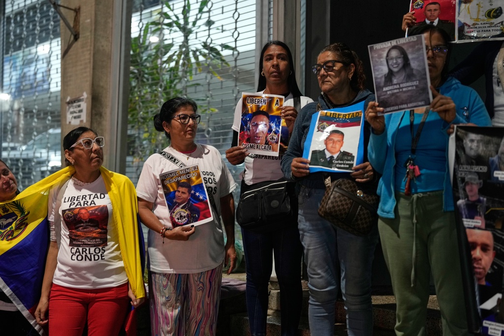Relatives of detainees gather the near El Helicoide, headquarters of Venezuela's intelligence service and a detention center, in Caracas, Venezuela, Friday, Jan. 30, 2026, on the same day acting President Delcy Rodríguez announced an amnesty bill that could lead to the release of hundreds of prisoners, including opposition leaders, journalists and human rights activists detained for political reasons. (AP Photo/Ariana Cubillos)