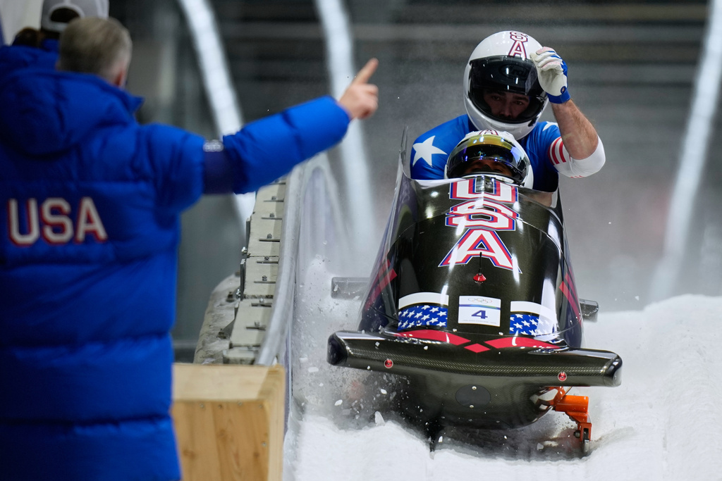 United States' Frankie del Duca, front, and Joshua Williamson arrive at the finish during a two man bobsled run at the 2026 Winter Olympics, in Cortina d'Ampezzo, Italy, Monday, Feb. 16, 2026. (AP Photo/Aijaz Rahi)