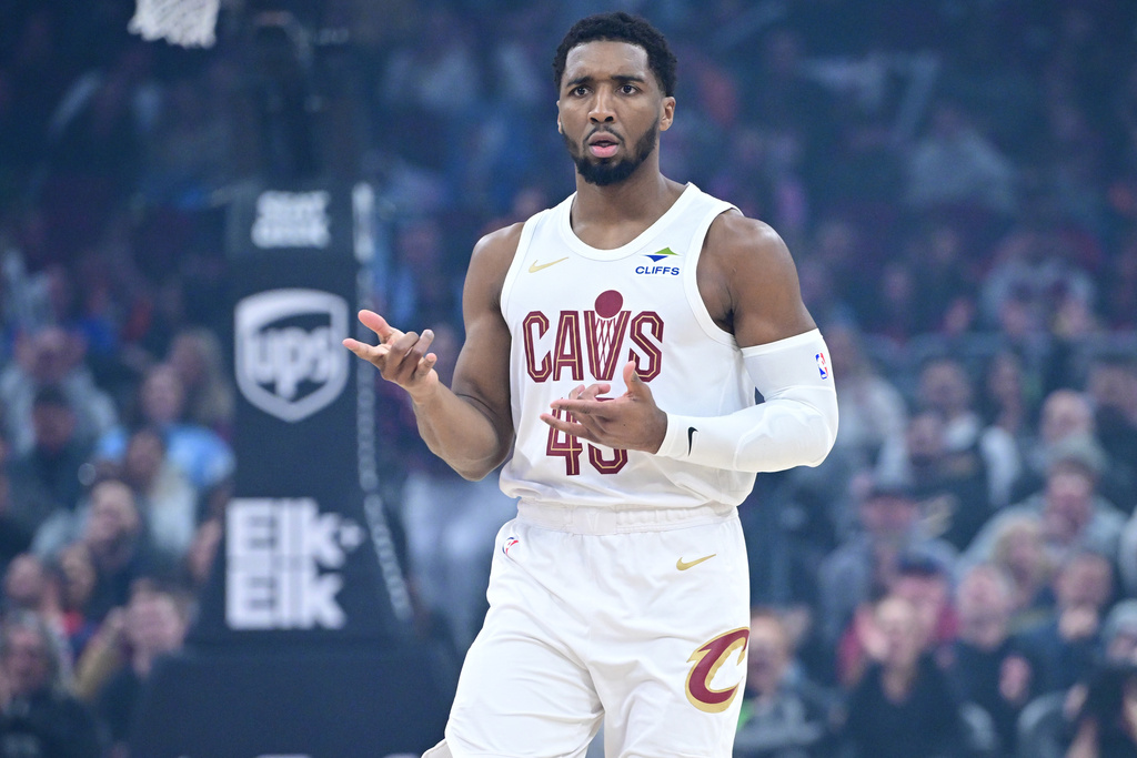 Cleveland Cavaliers guard Donovan Mitchell celebrates after making a three-point basket in the first half of an NBA basketball game against the Sacramento Kings, Friday, Jan. 23, 2026, in Cleveland. (AP Photo/David Dermer)