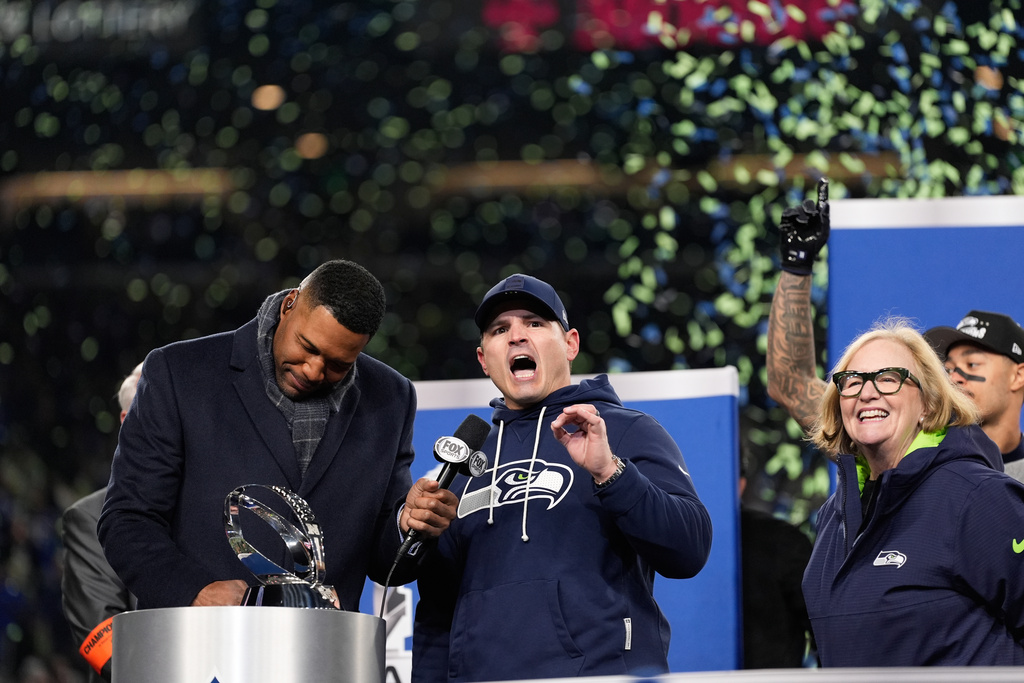 Michael Strahan left stands next to Seattle Seahawks head coach Mike Macdonald after a win over Los Angeles Rams in the NFC Championship NFL football game Sunday, Jan. 25, 2026, in Seattle. (AP Photo/Godofredo A. Vásquez)